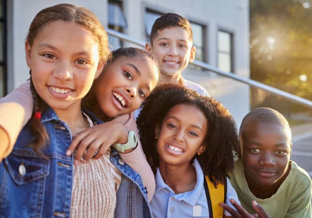 Friends, smile and selfie with children in school for teamwork, education and diversity. Support, scholarship and learning with portrait of group of students for happy, youth and collaboration Friends, smile and selfie with children in school for teamwork, education and diversity. Support, scholarship and learning with portrait of group of students for happy, youth and collaboration.